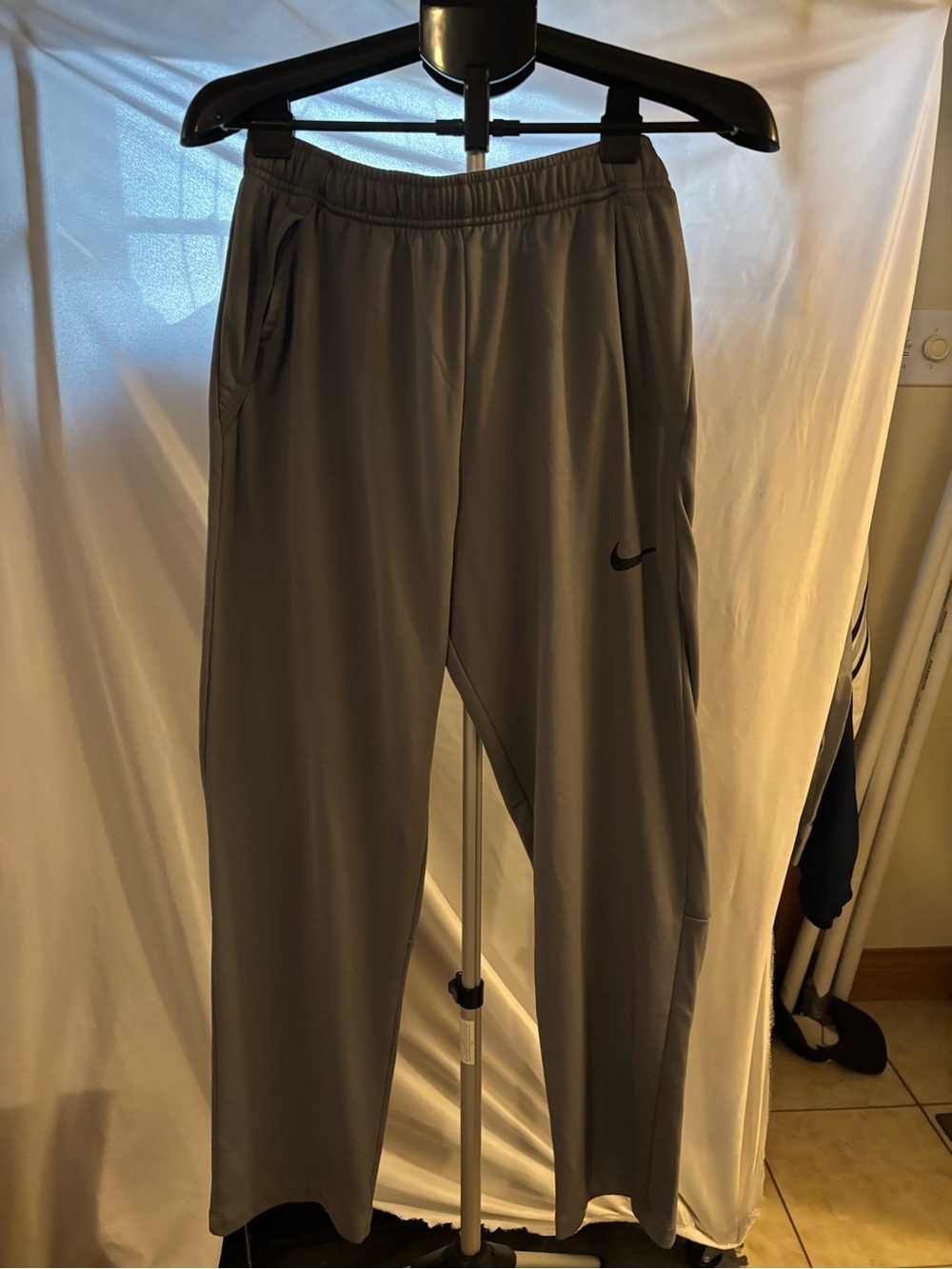 Nike Men's Light Gray Athletic Joggers with Black Swoosh